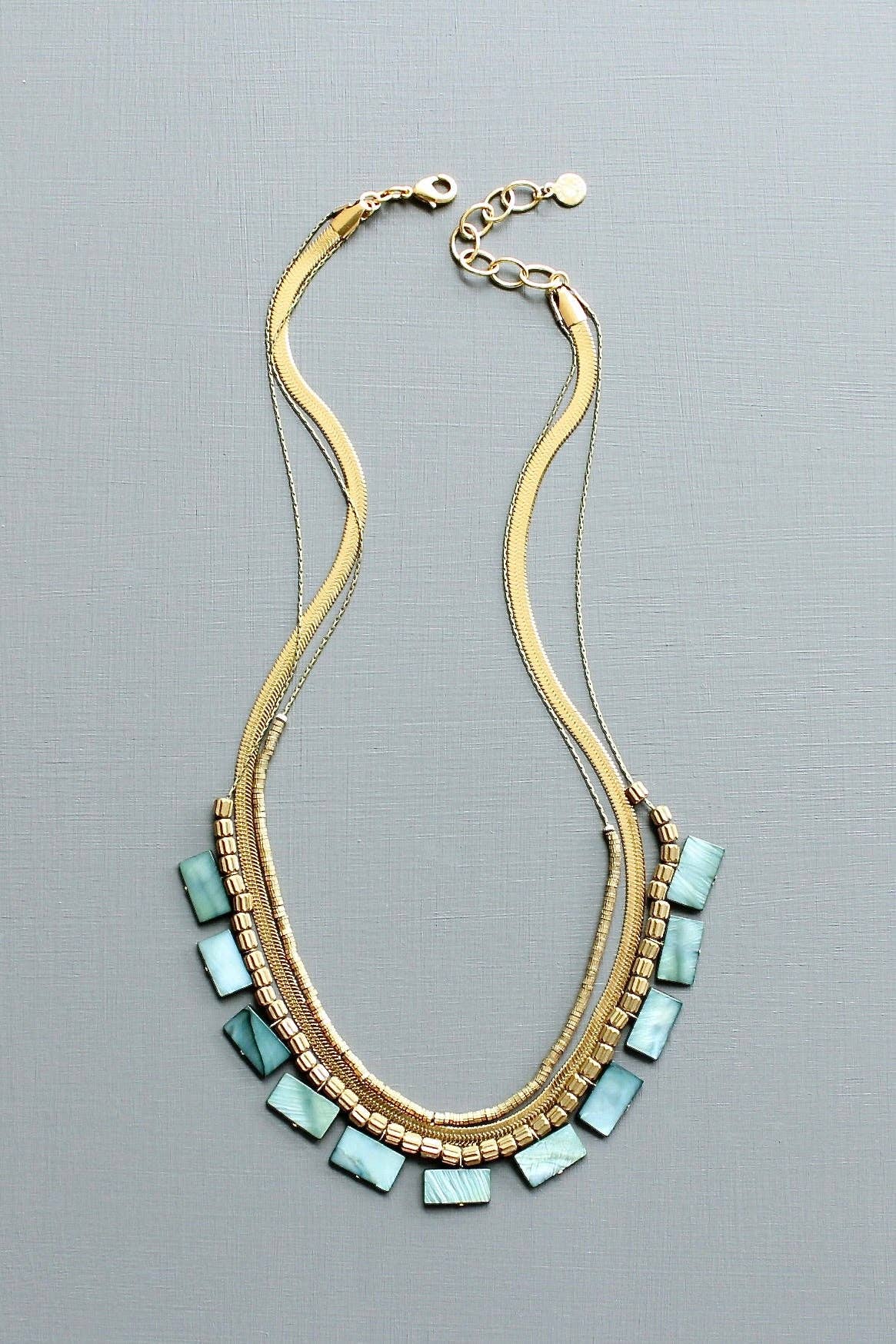 Green shell and snake chain triple-strand necklace