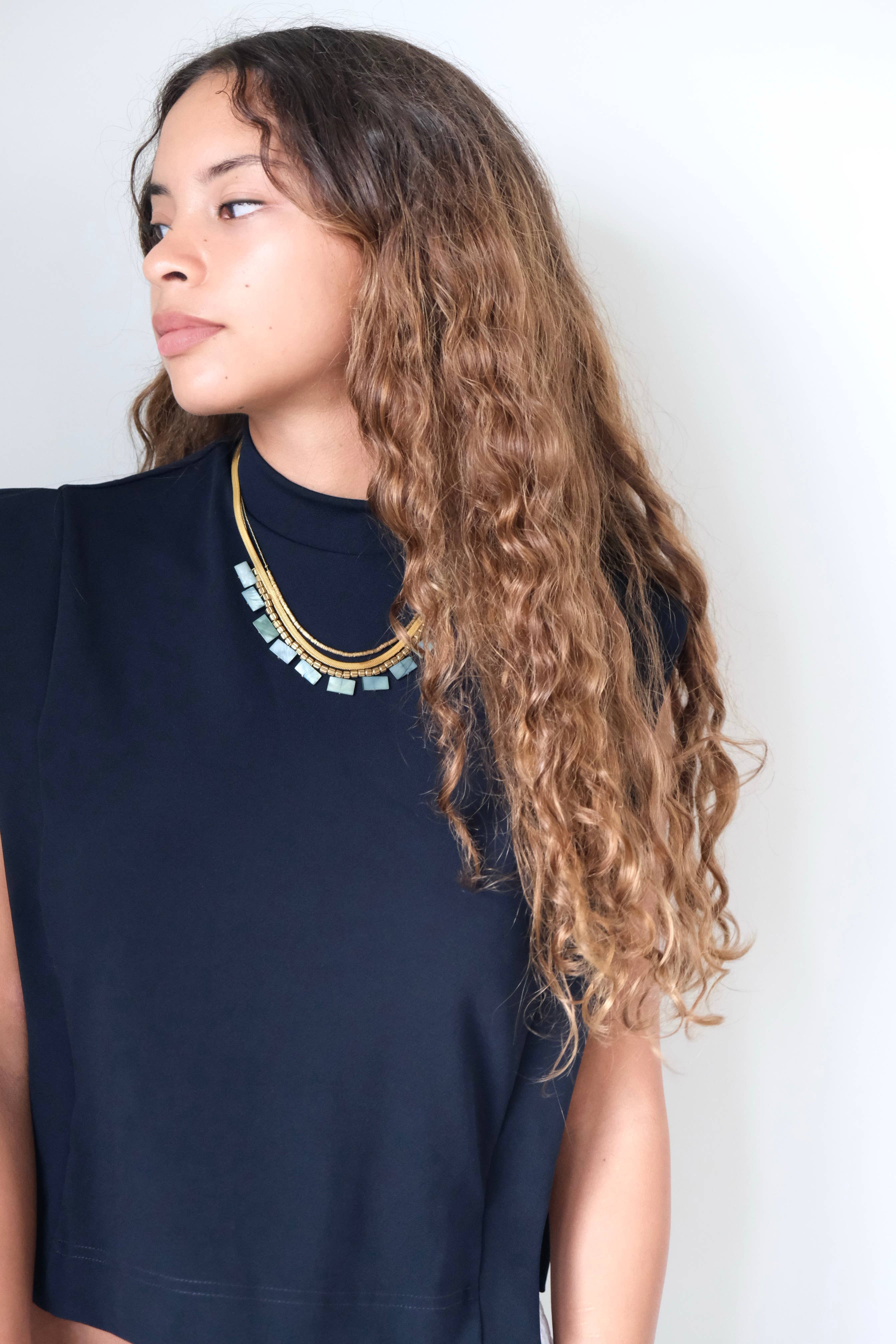 Green shell and snake chain triple-strand necklace