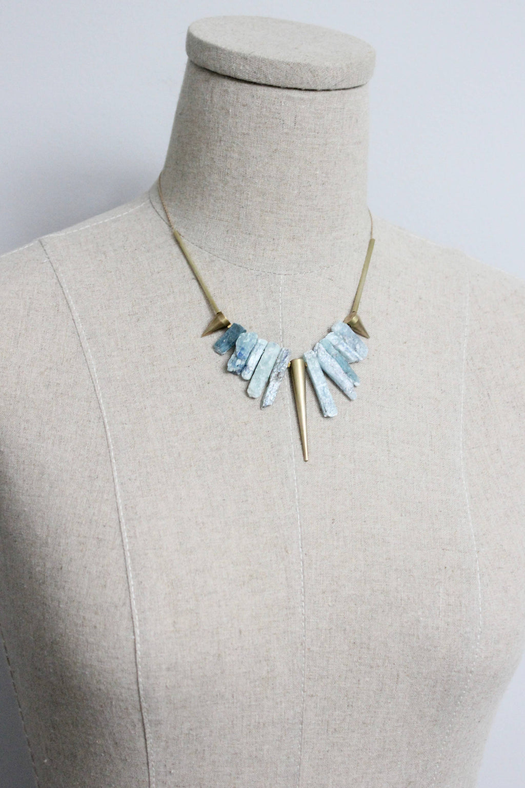 Kyanite and brass geometric necklace