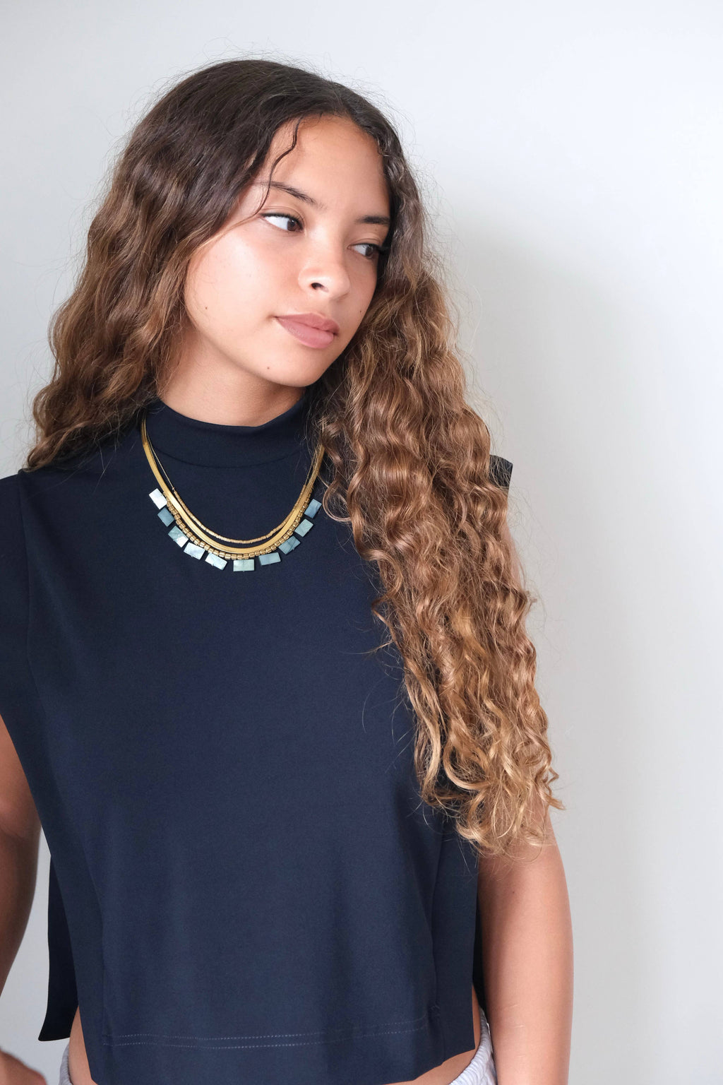 Green shell and snake chain triple-strand necklace